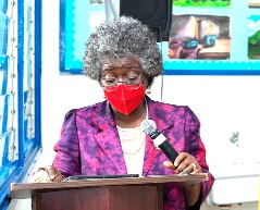 Professor Afua Hesse, President of the Accra College of Medicine, addressing some students of the  Roman Ridge School during the workshop
